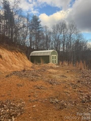151 Thunderstruck Ridge Burnsville, NC 28714 - Photo 7 of 13 a view of a house with a yard