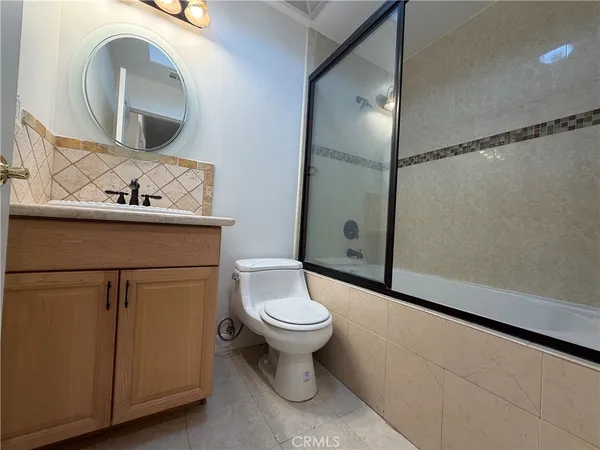 a view of bathroom and a hallway view