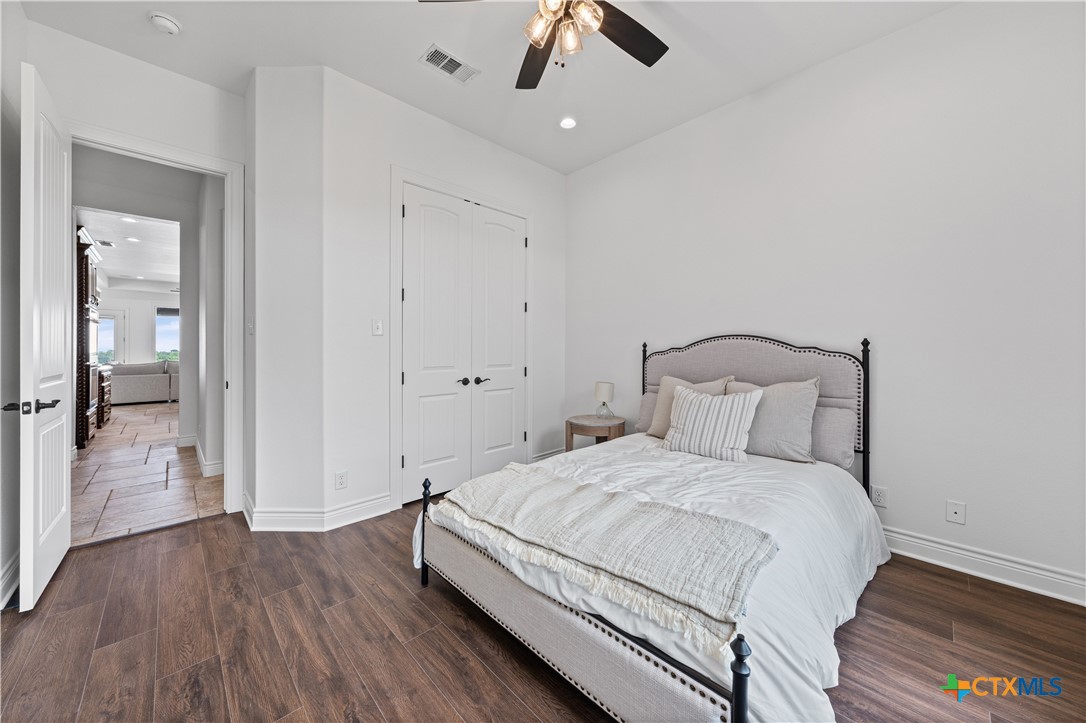 11023 Bigham Road Troy, TX 76579 - Photo 42 of 42 a bedroom with a bed and wooden floor