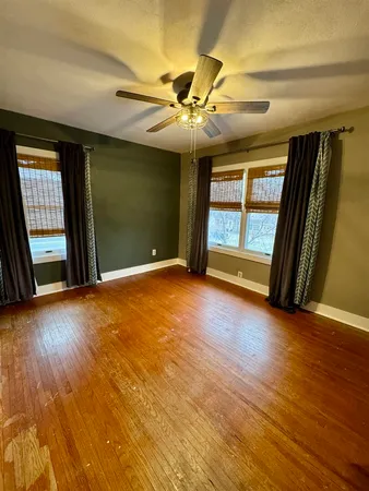 a view of a big room with closet and wooden floor