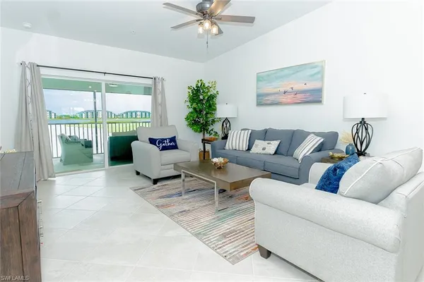 a living room with furniture and a large window