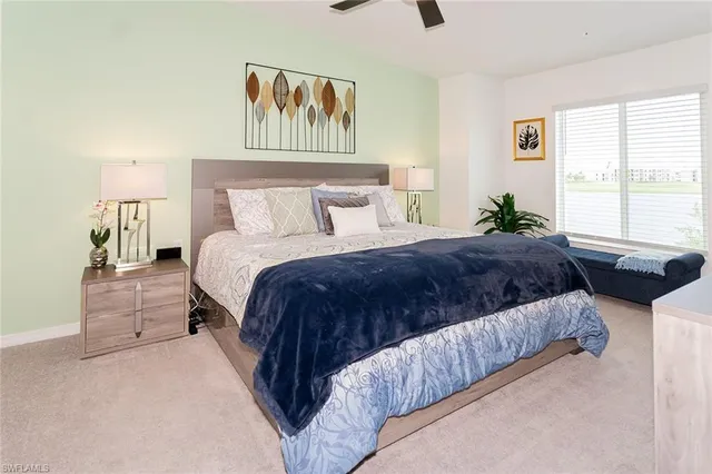 a bedroom with bed and window