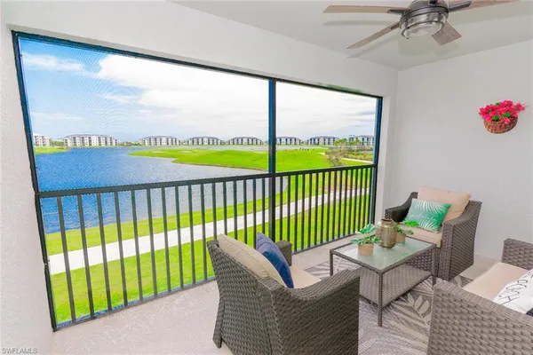 a view of a balcony with furniture