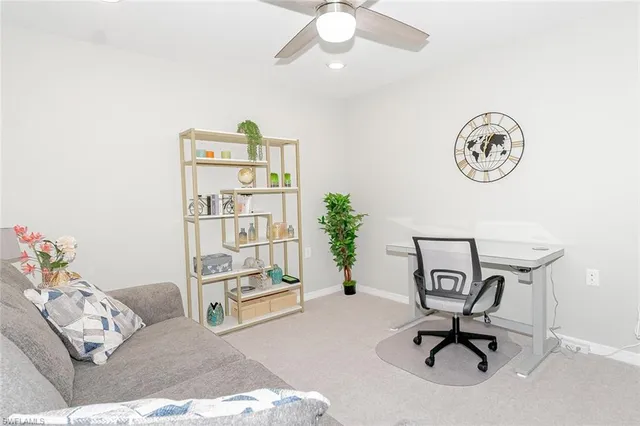 a view of workspace with a couch