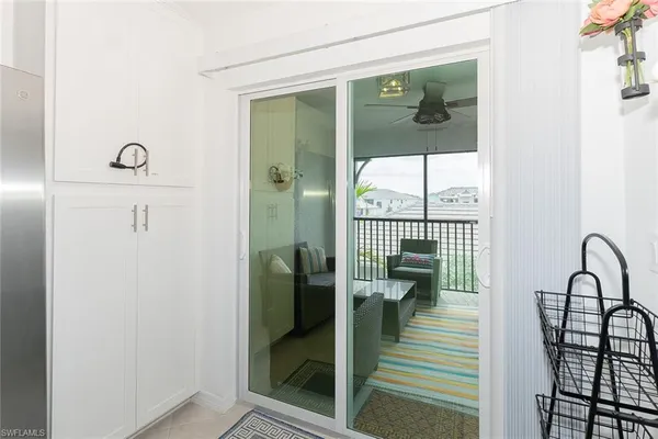 view of a hallway with wooden floor and a potted plant