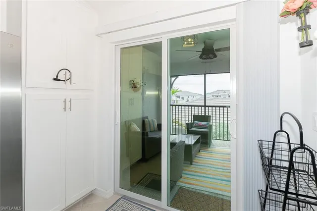 view of a hallway with wooden floor and a potted plant