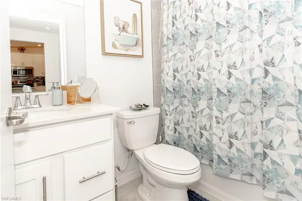 a bathroom with a toilet and a sink