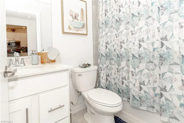 a bathroom with a toilet and a sink