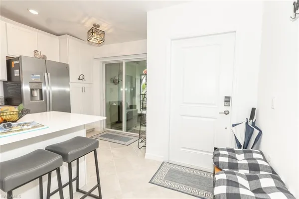 a dining room with table and chairs