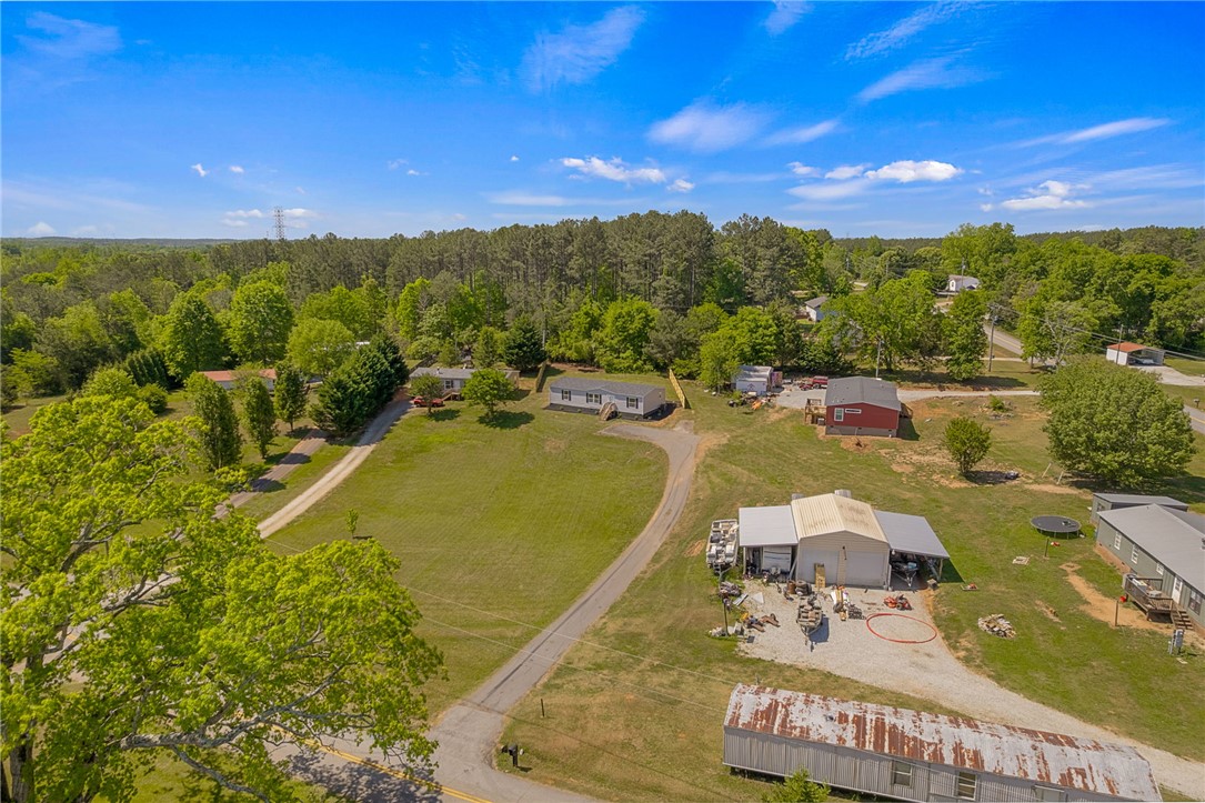 375 Griggs Road Six Mile, SC 29682 - Photo 34 of 36 Expansive rural property offers ample space with multiple structures and a vast green landscape.