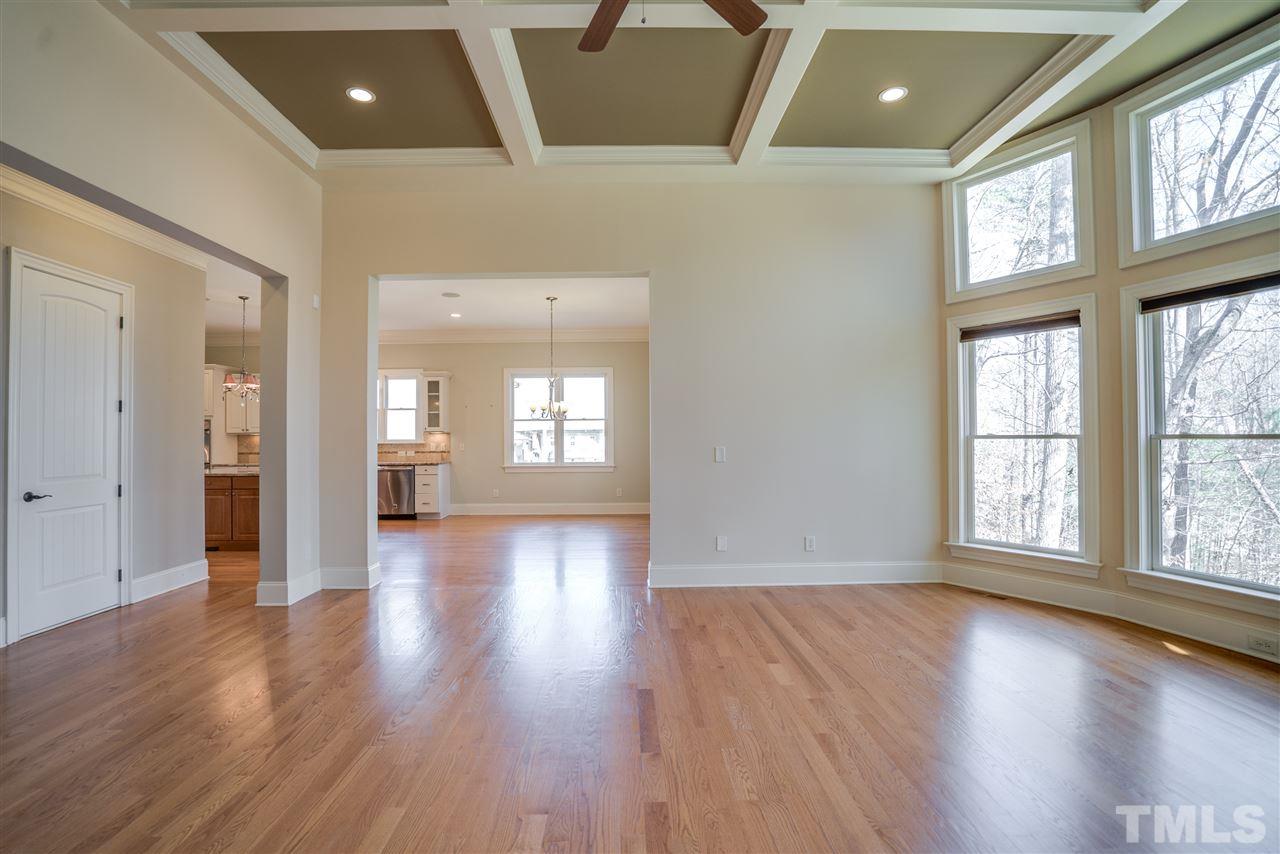 9008 Albatross Court Raleigh, NC 27613 - Photo 13 of 25 an empty room with wooden floor and windows