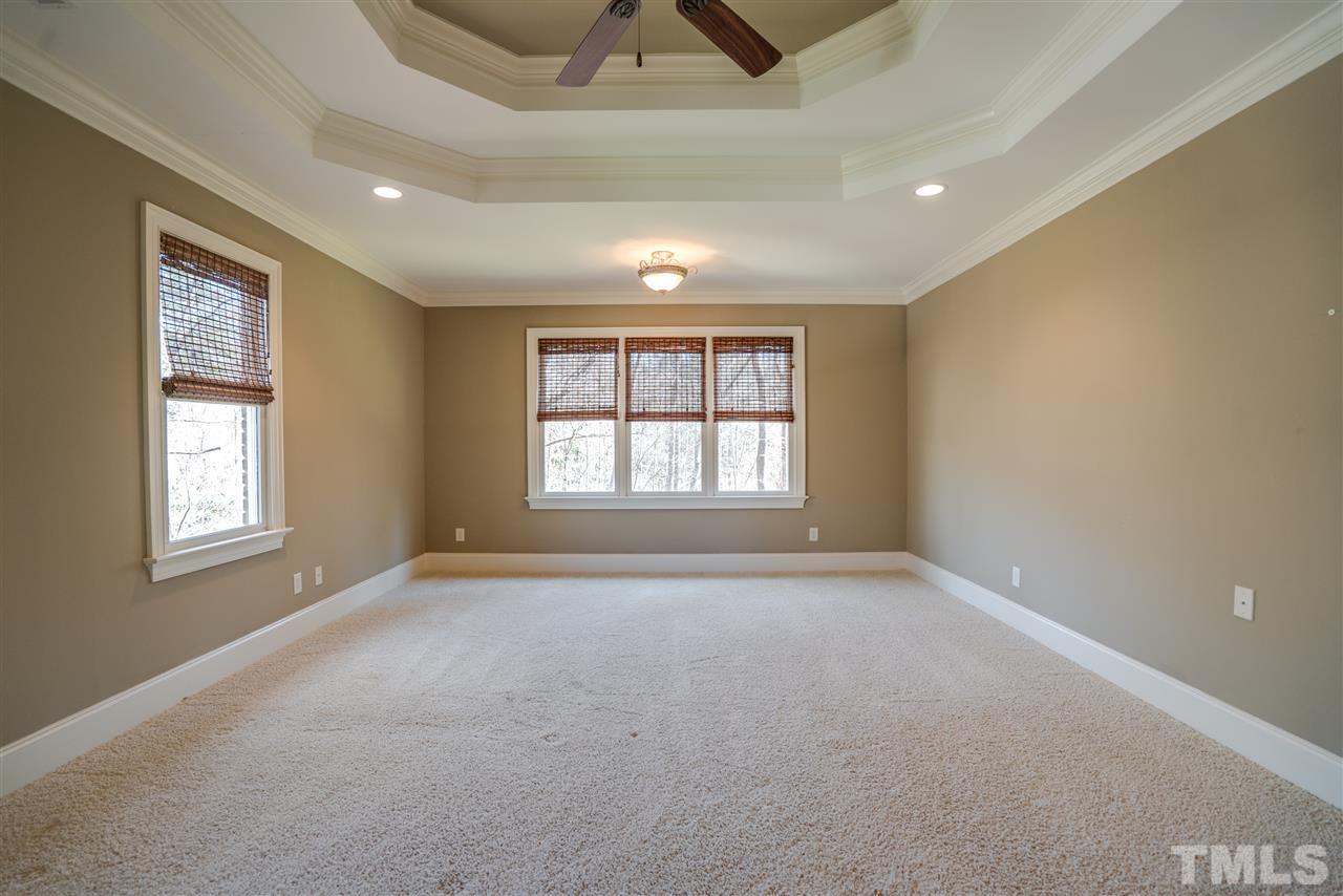 9008 Albatross Court Raleigh, NC 27613 - Photo 16 of 25 a view of an empty room with a window