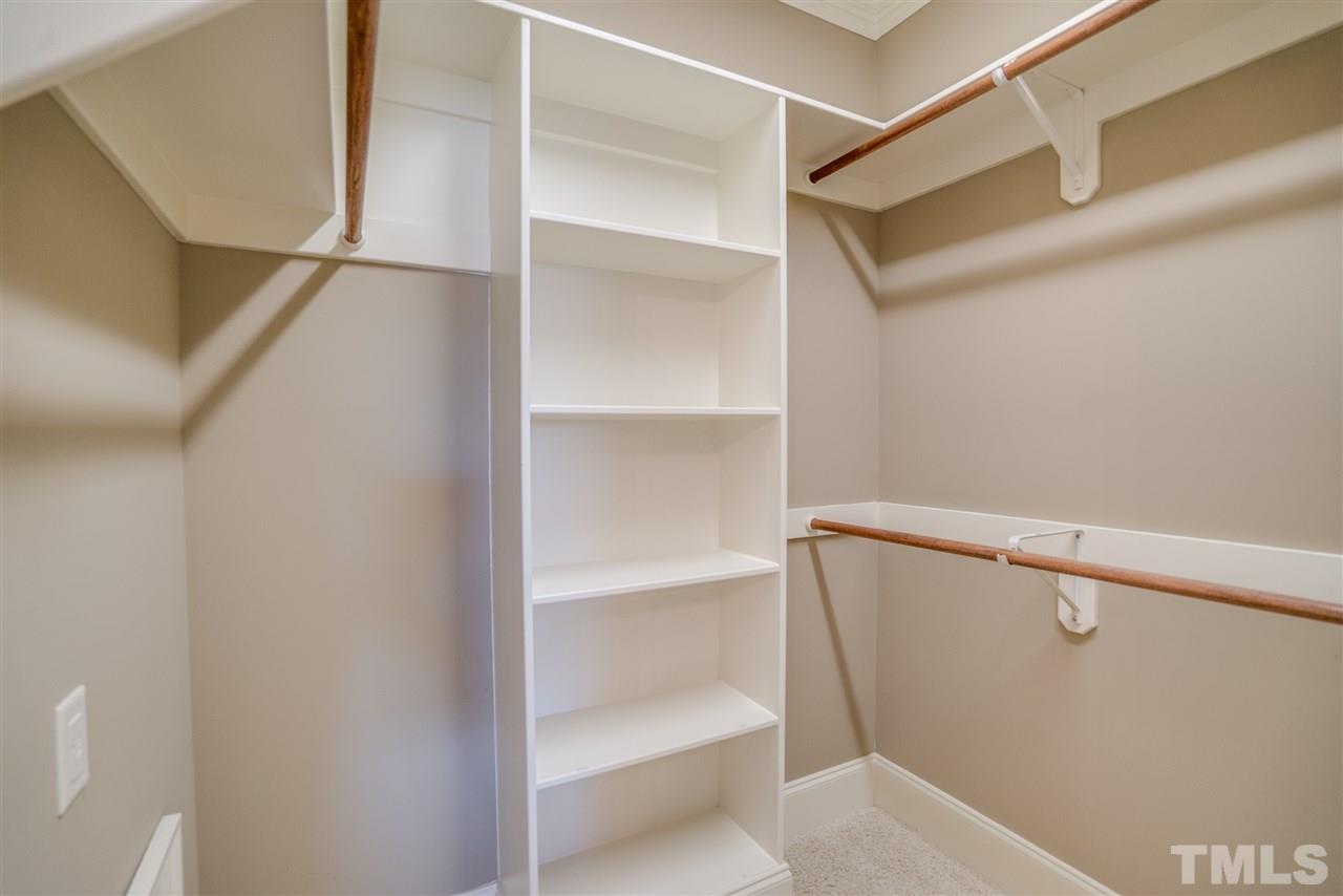 9008 Albatross Court Raleigh, NC 27613 - Photo 20 of 25 a view of walk in closet with empty racks
