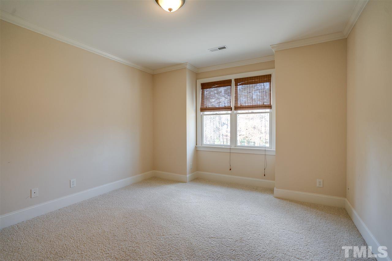 9008 Albatross Court Raleigh, NC 27613 - Photo 21 of 25 an empty room with a window