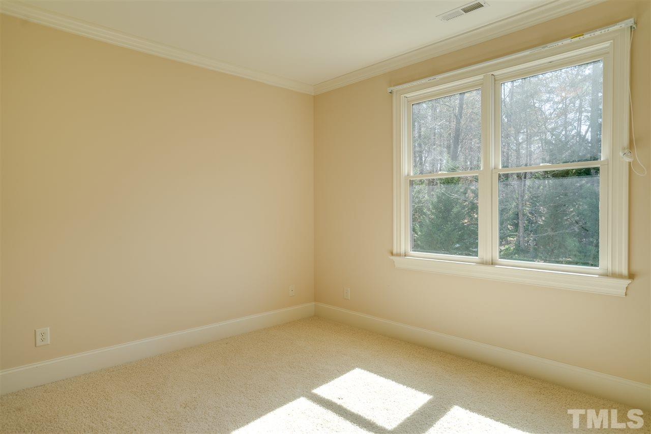 9008 Albatross Court Raleigh, NC 27613 - Photo 24 of 25 an empty room with a window