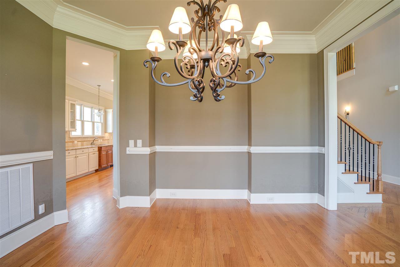 9008 Albatross Court Raleigh, NC 27613 - Photo 7 of 25 a view of a livingroom with wooden floor