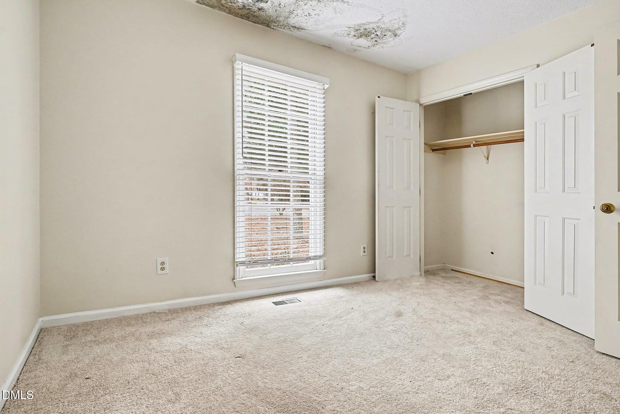 1201 Deptford Court Raleigh, NC 27609 - Photo 12 of 20 a view of an empty room with a window