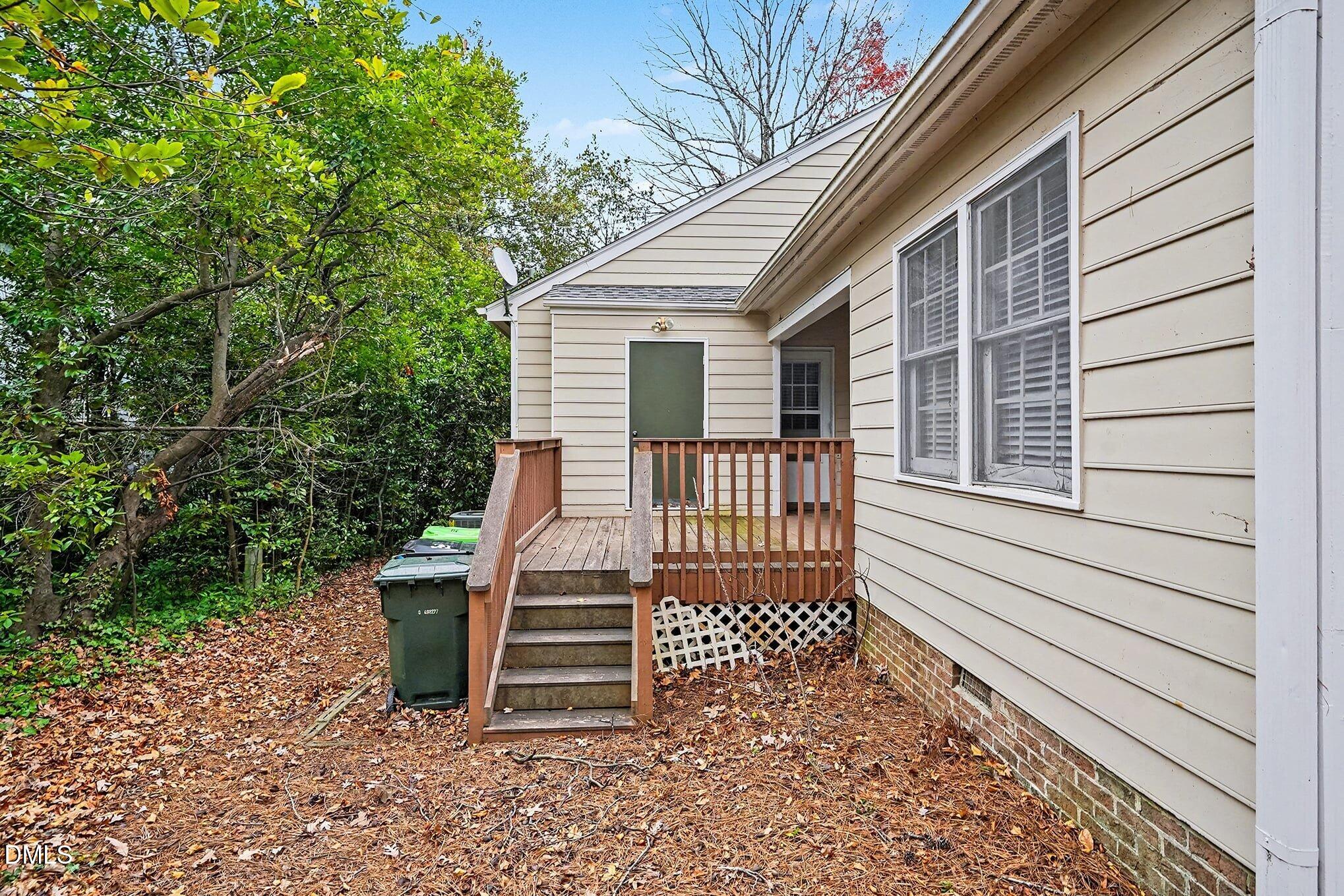1201 Deptford Court Raleigh, NC 27609 - Photo 18 of 20 a view of a house with wooden fence