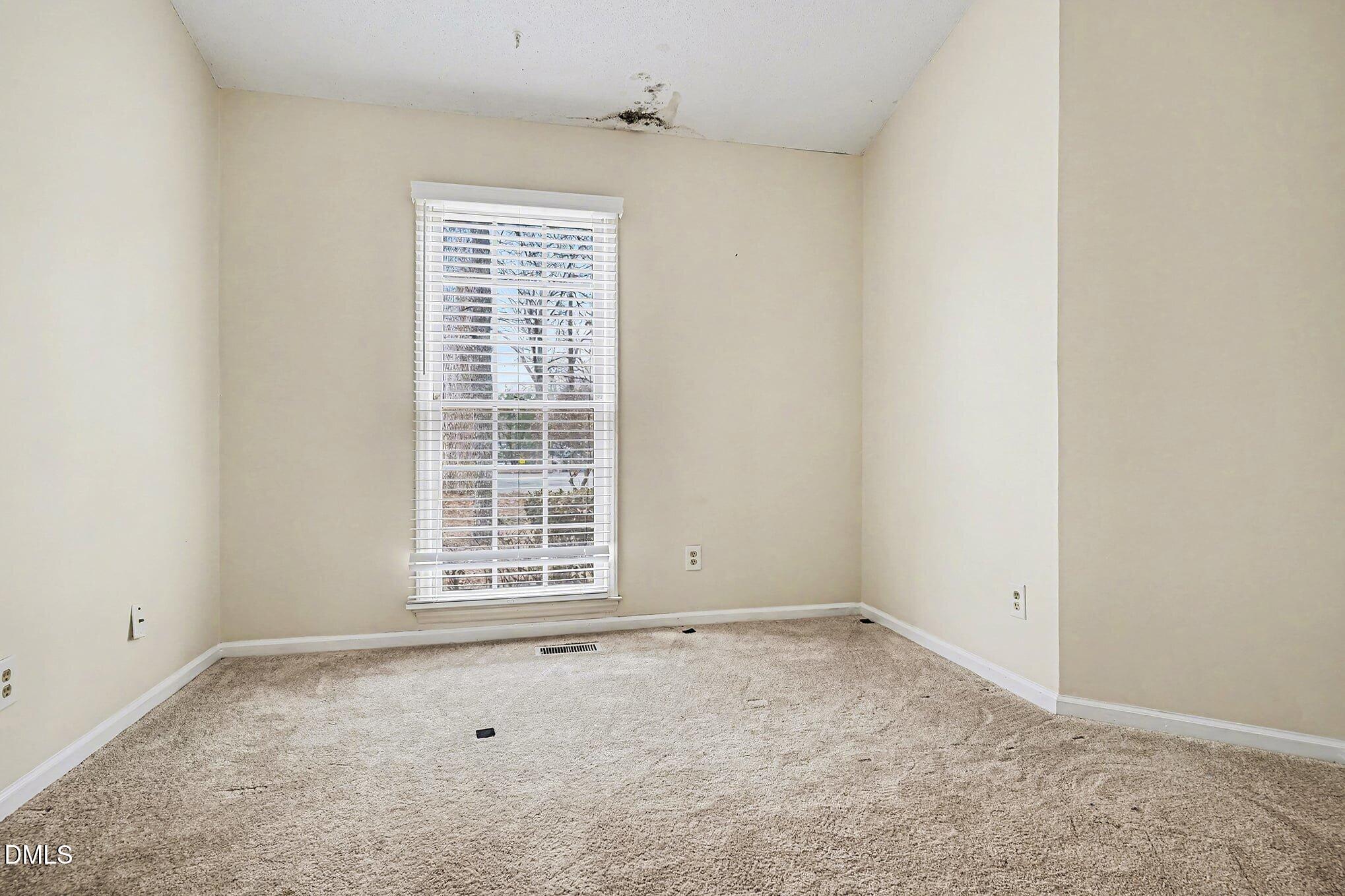 1201 Deptford Court Raleigh, NC 27609 - Photo 8 of 20 a view of an empty room with a window