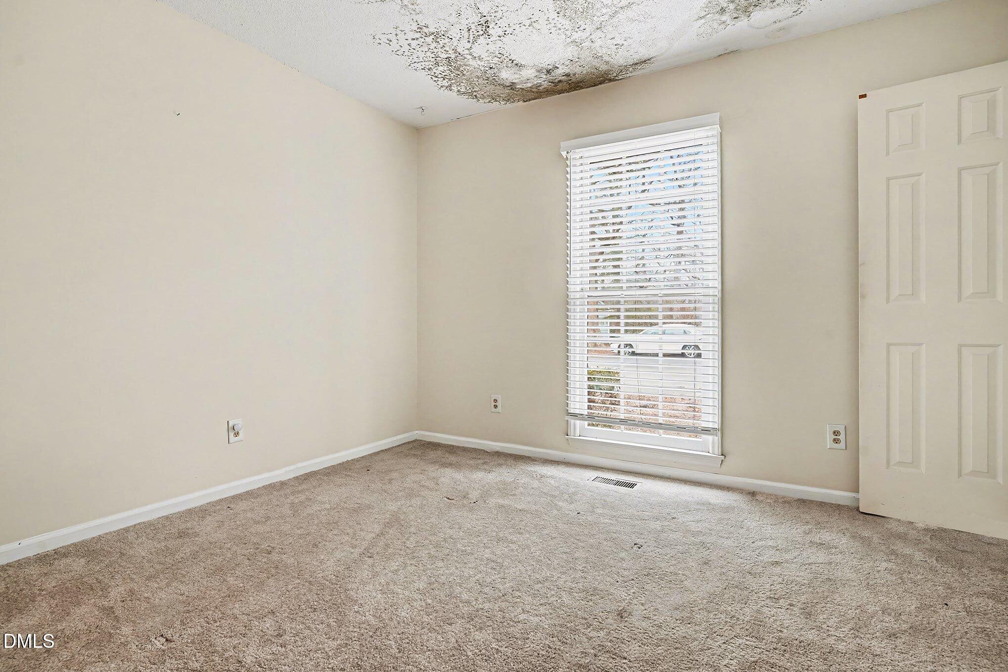 1201 Deptford Court Raleigh, NC 27609 - Photo 10 of 20 an empty room with a window