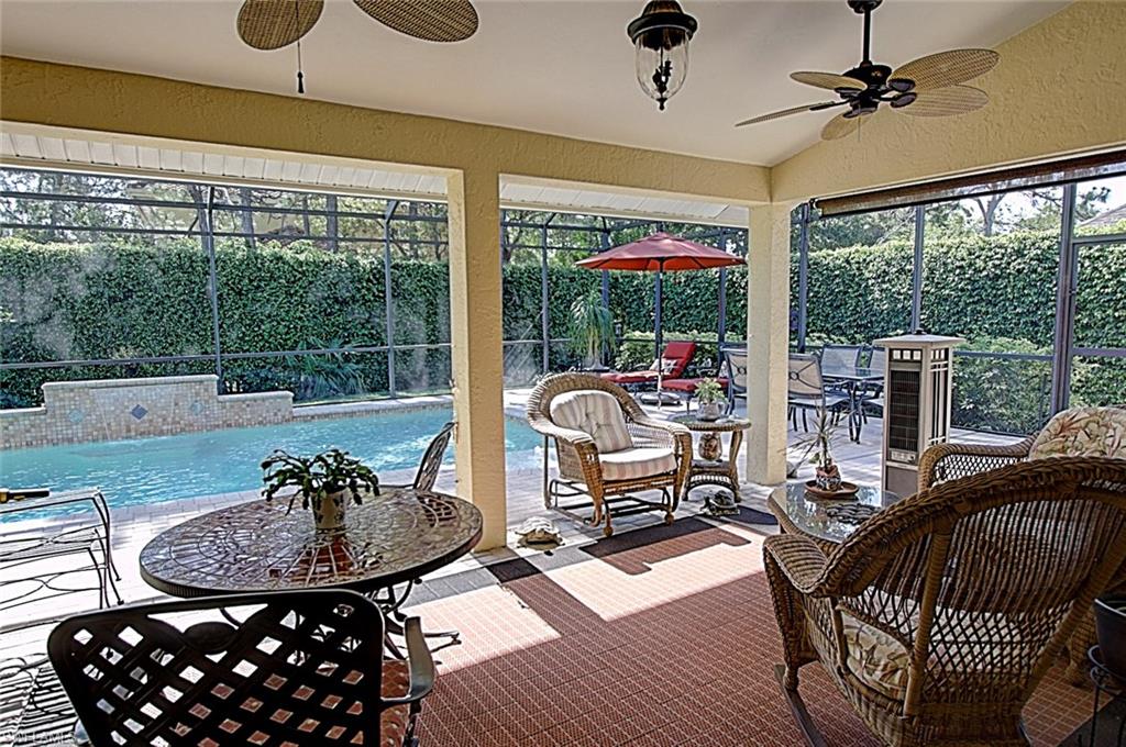 6706 Mill Run Road Naples, FL 34109 - Photo 18 of 20 a living room with furniture and a large window