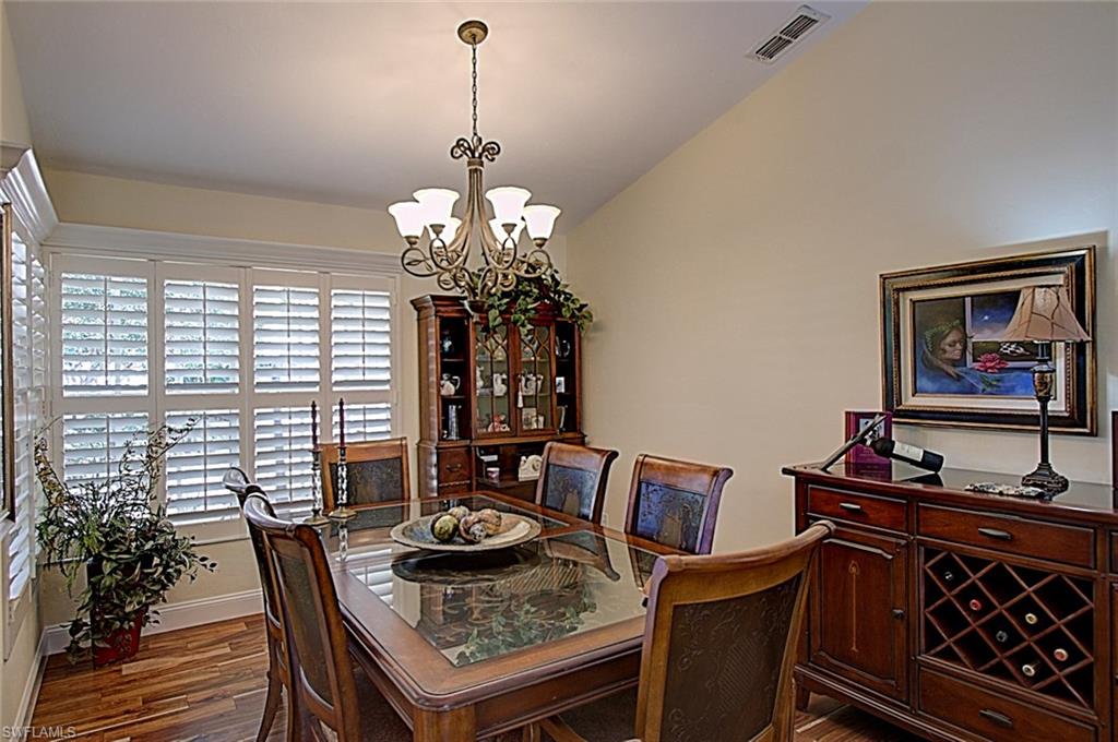 6706 Mill Run Road Naples, FL 34109 - Photo 3 of 20 a view of a dining room with furniture window and outside view