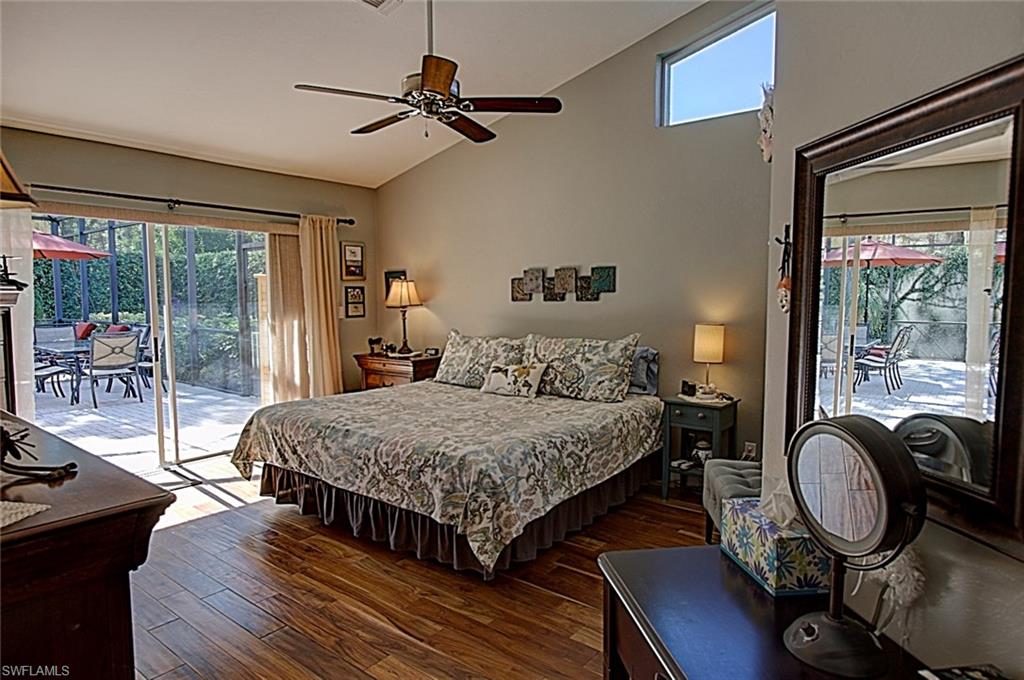 6706 Mill Run Road Naples, FL 34109 - Photo 5 of 20 a bedroom with bed and wooden floor