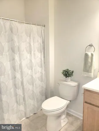 a bathroom with a shower and a toilet