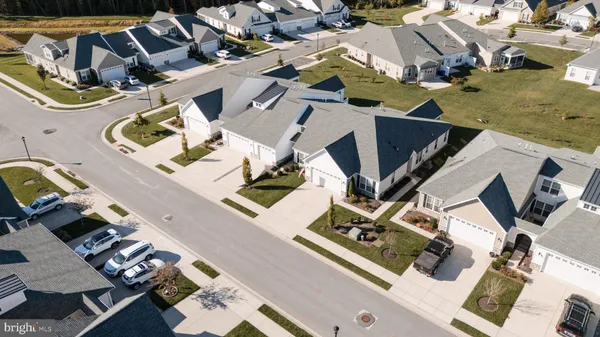 an aerial view of a house with swimming pool