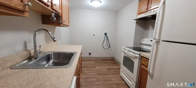 a kitchen with a sink and washing machine