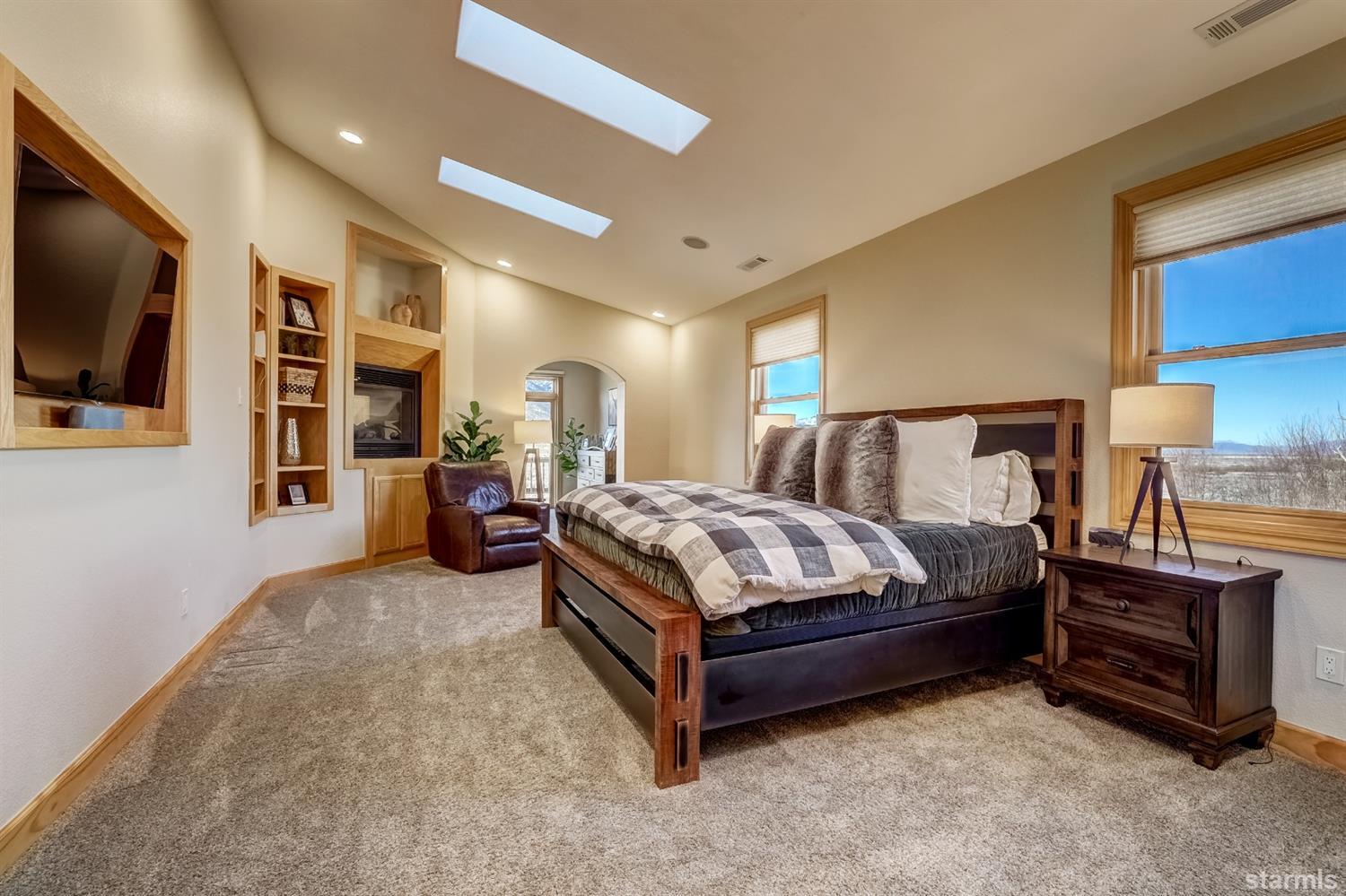 420 River Ranch Road Woodfords, CA 96120 - Photo 11 of 25 a spacious bedroom with a bed and a flat screen television