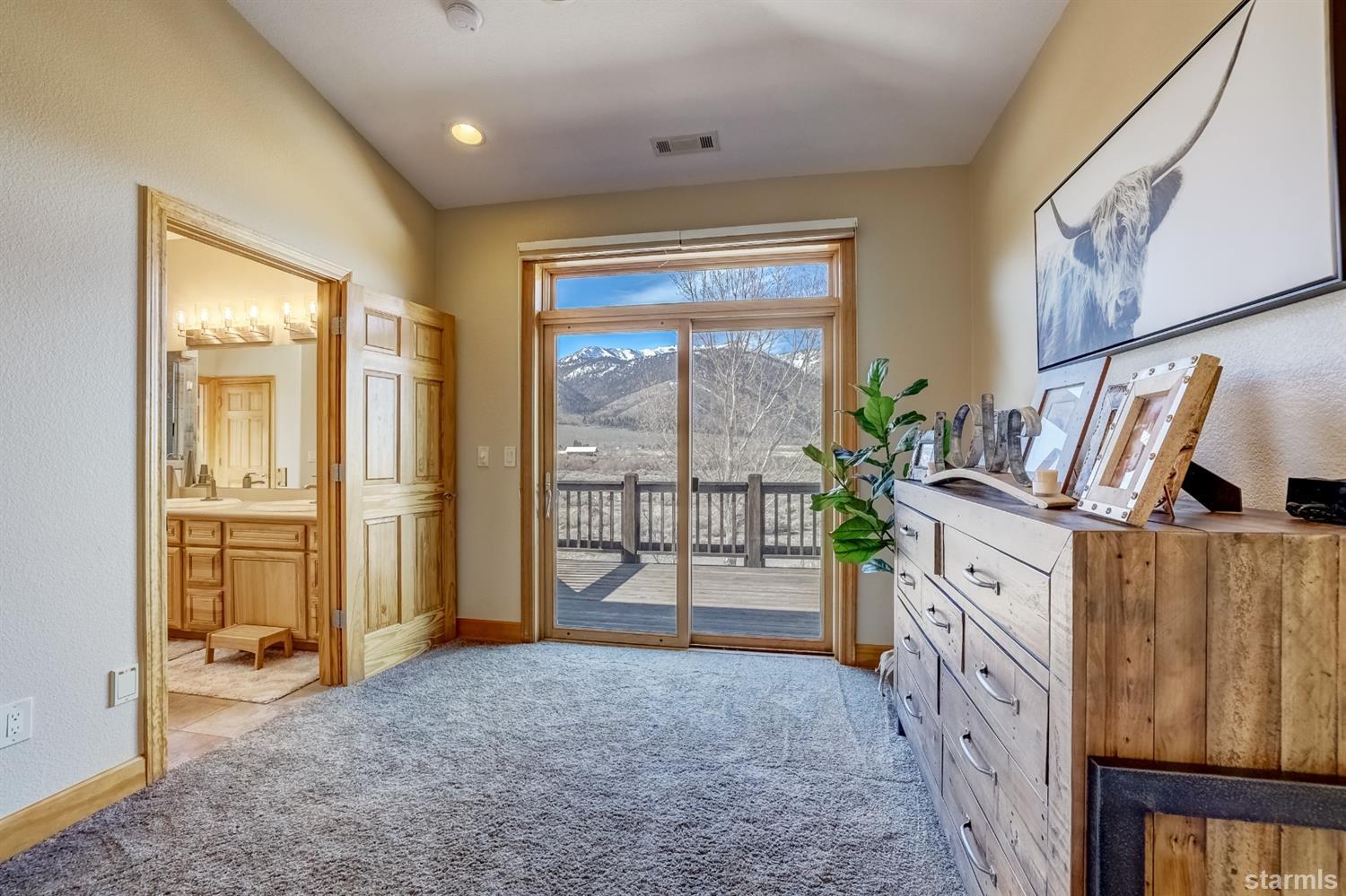 420 River Ranch Road Woodfords, CA 96120 - Photo 12 of 25 a spacious bedroom with a large bed and a dresser