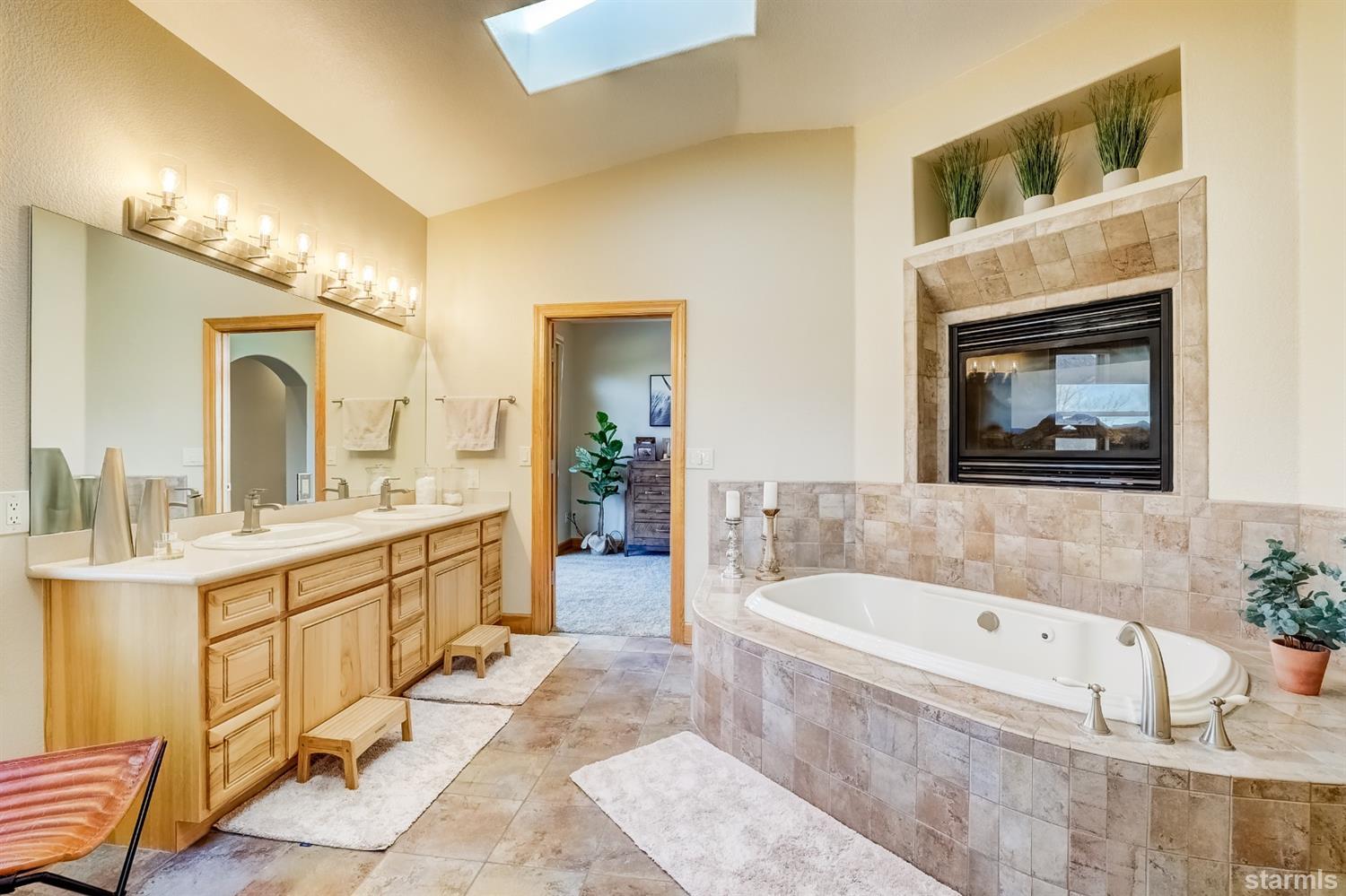 420 River Ranch Road Woodfords, CA 96120 - Photo 13 of 25 a bathroom with a tub a sink and a mirror