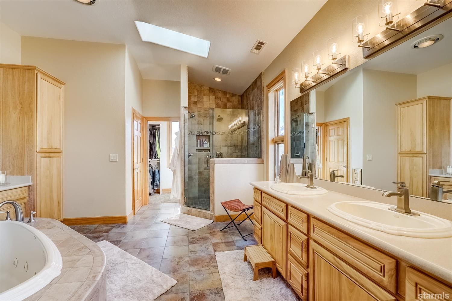 420 River Ranch Road Woodfords, CA 96120 - Photo 14 of 25 a spacious bathroom with a bathtub sink and mirror