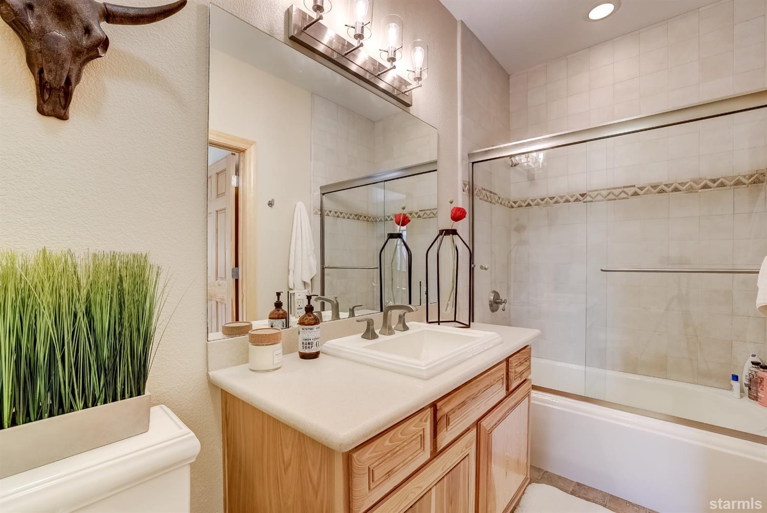 420 River Ranch Road Woodfords, CA 96120 - Photo 16 of 25 a bathroom with a sink and a mirror