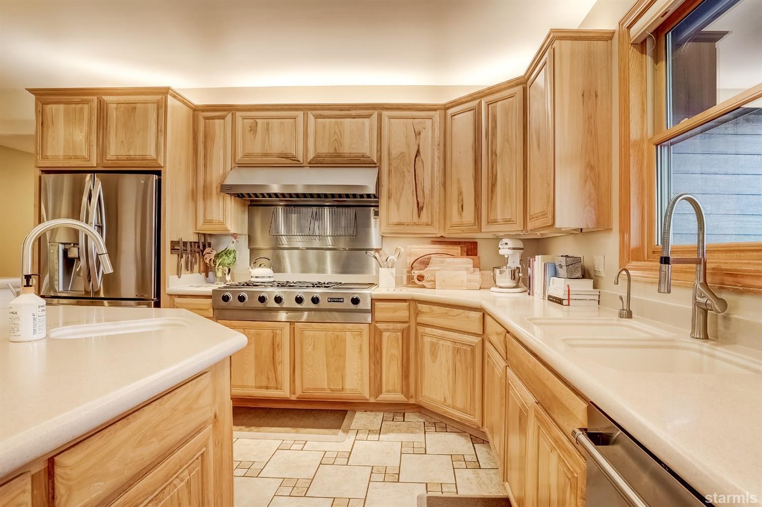 420 River Ranch Road Woodfords, CA 96120 - Photo 4 of 25 a kitchen with stainless steel appliances granite countertop a sink stove and refrigerator