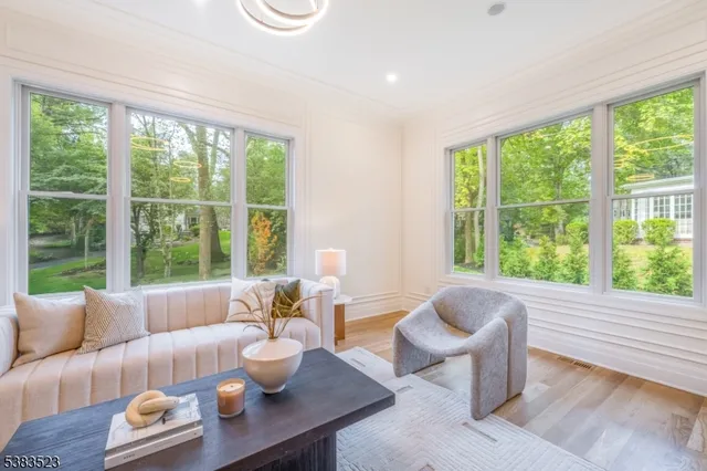 a spacious bedroom with a bed and a large window