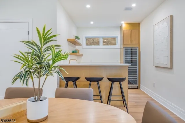 a living room with furniture potted plant and a table