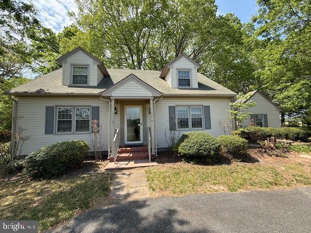 28955 Log Cabin Road Salisbury, MD 21801 - Photo 2 of 39 a front view of a house with a yard and porch