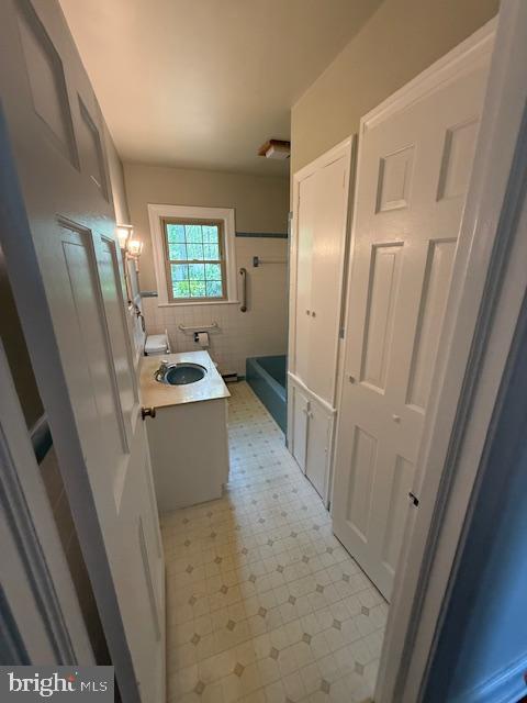 28955 Log Cabin Road Salisbury, MD 21801 - Photo 34 of 39 a bathroom with a sink a washer and dryer