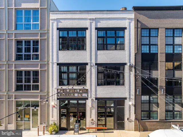 a front view of a building with glass windows
