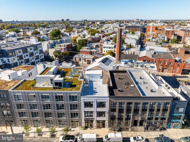 a view of a kitchen with a sink and cabinets