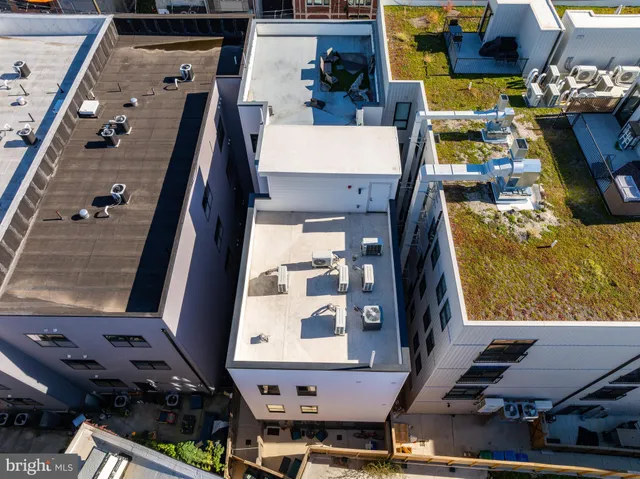 a terrace with outdoor seating and city view