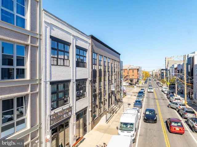 a kitchen with stainless steel appliances granite countertop white cabinets a stove top oven a sink and dishwasher