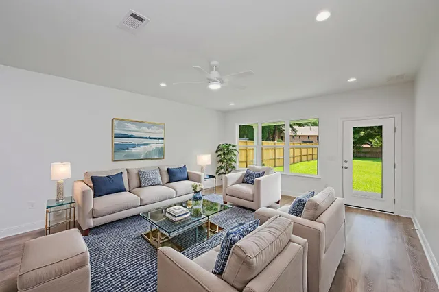 a bedroom with a bed and a plant