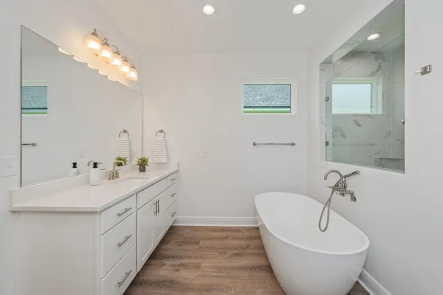 a bathroom with a sink and mirror