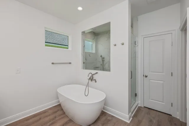a white bath tub sitting in a bathroom