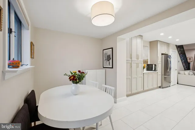 a view of kitchen with furniture and wooden floor