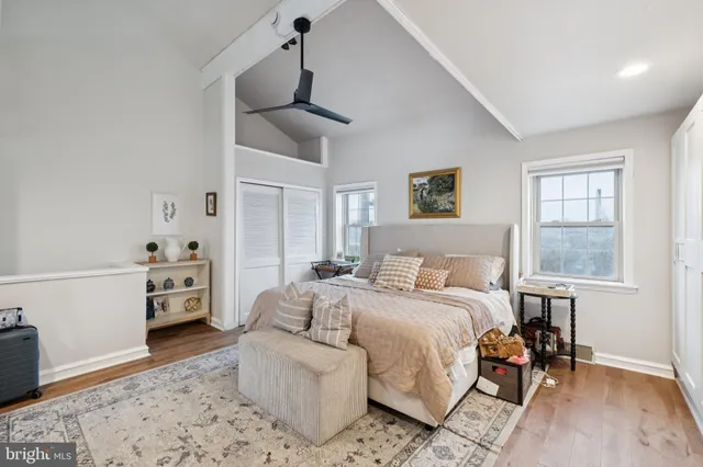 a bedroom with furniture and a chandelier
