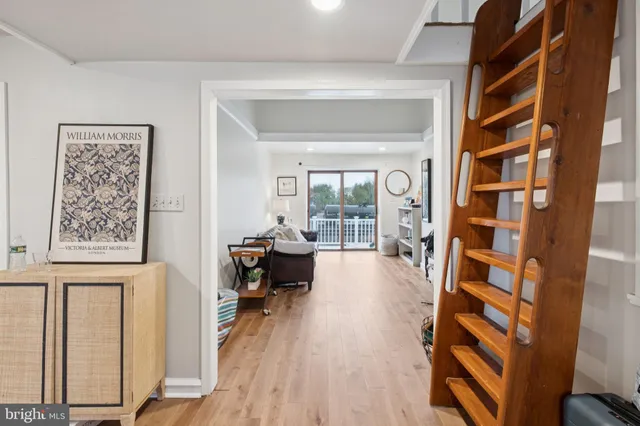 a view of a livingroom with furniture and workspace